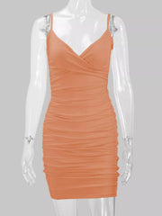 Peach-orange spaghetti-strap ruched mini dress displayed front-facing on a mannequin.
