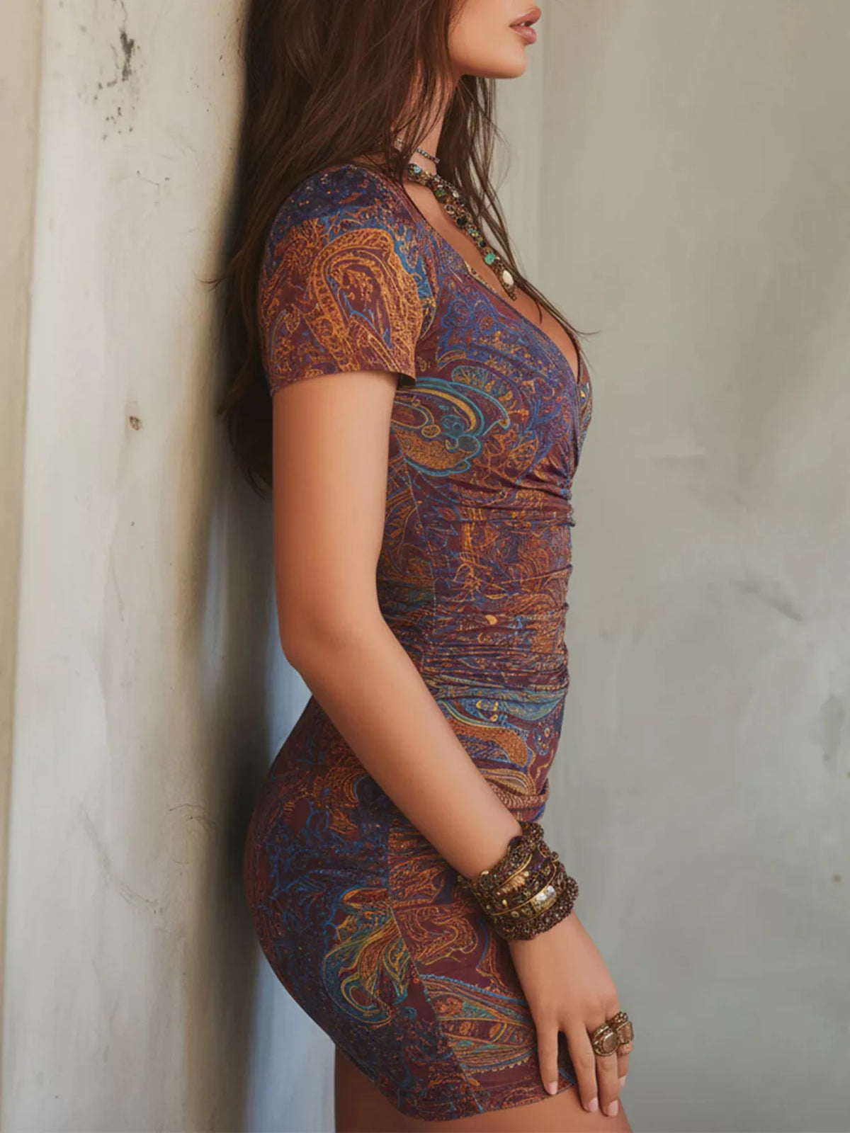Side view of the multicolor paisley mini dress with gathered waist