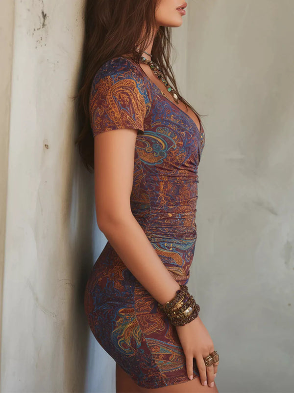 Side view of the multicolor paisley mini dress with gathered waist