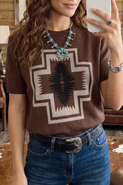Front view of western cross graphic tee styled with jeans