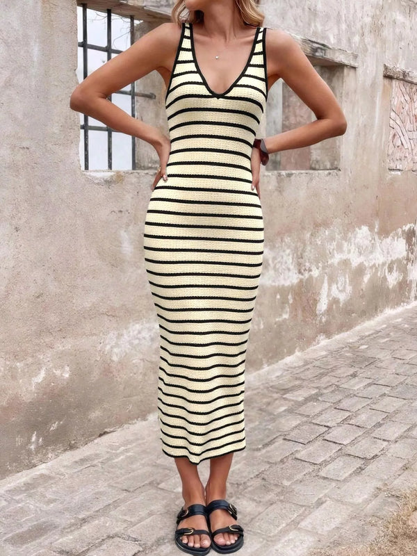 Striped bodycon knit midi dress showing fitted shape and side slit