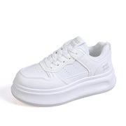 Single white lace-up platform sneaker, side view