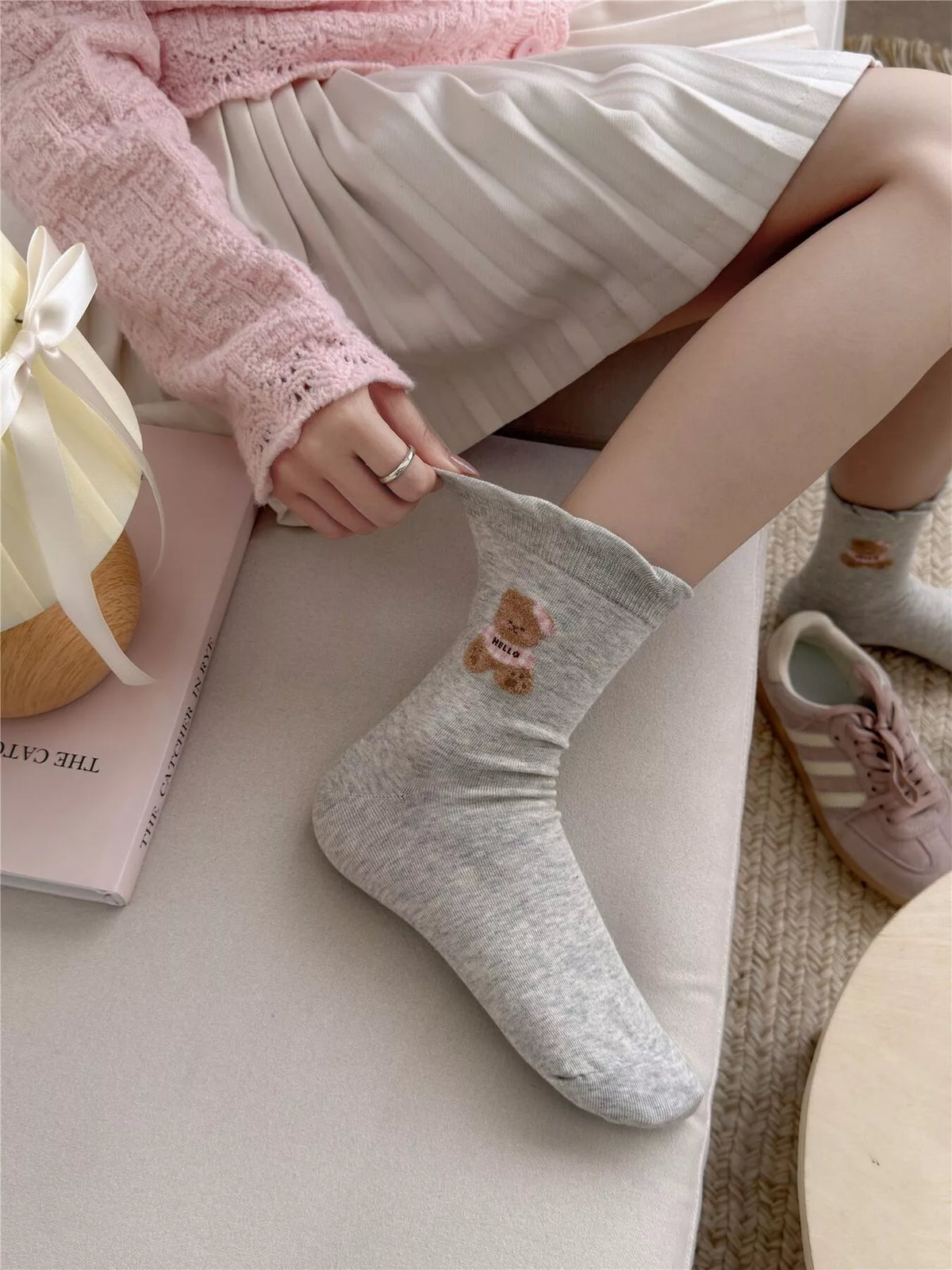Close view of the bear motif on gray socks