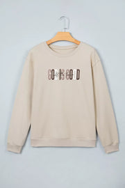 Beige God Is Good graphic crew-neck sweatshirt displayed from the front on a hanger
