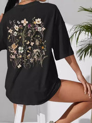 Black oversized tee with large multicolored wildflower print on the back