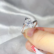 Close-up of the round moissanite centre stone and silver setting