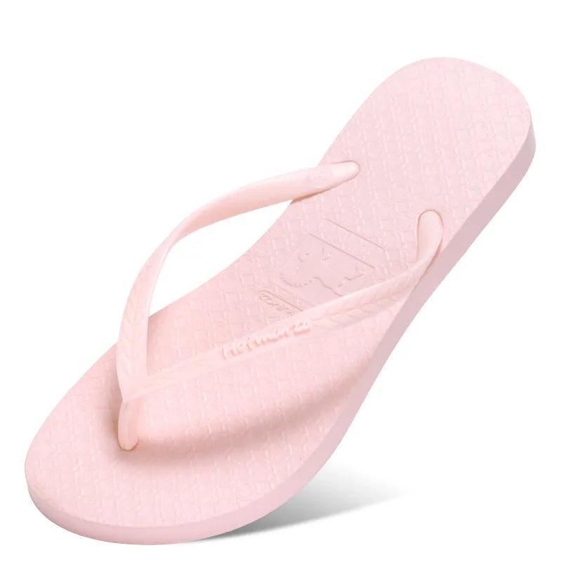 Light pink toe-post flip-flop with matching straps and textured footbed