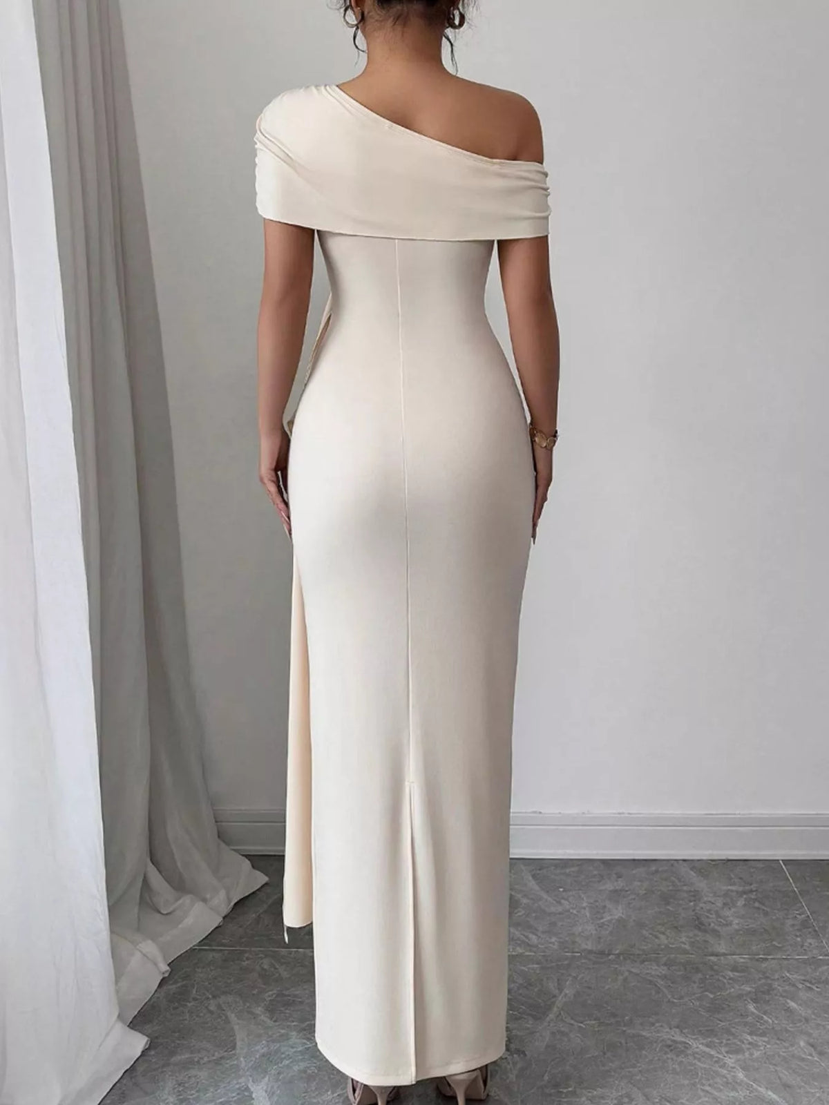 Ivory one-shoulder ruched maxi dress, back view