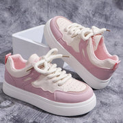 Pink and white platform sneaker side view