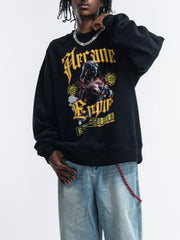 Model wearing black sweatshirt with gold gothic chest graphic