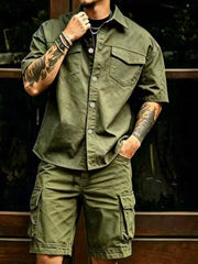 Model wearing olive cargo shirt and matching shorts with flap chest pocket