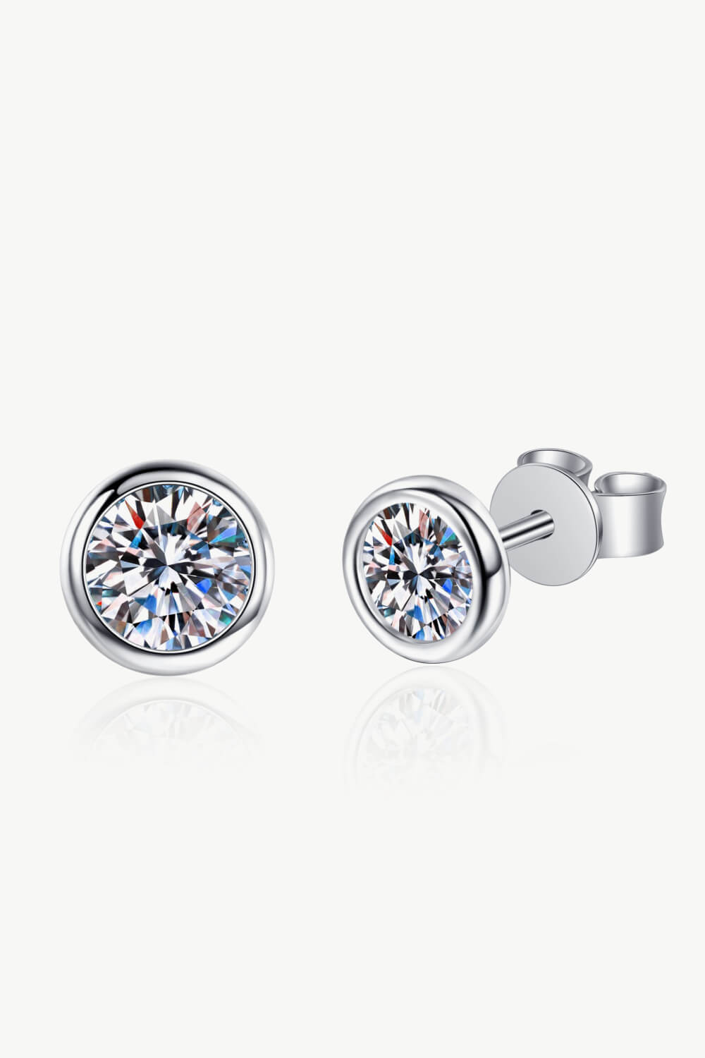 Pair of round clear-stone studs, front view