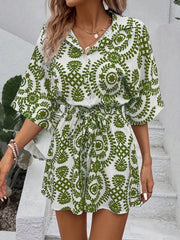Women's printed tie-waist button-front romper, green-and-white print side view
