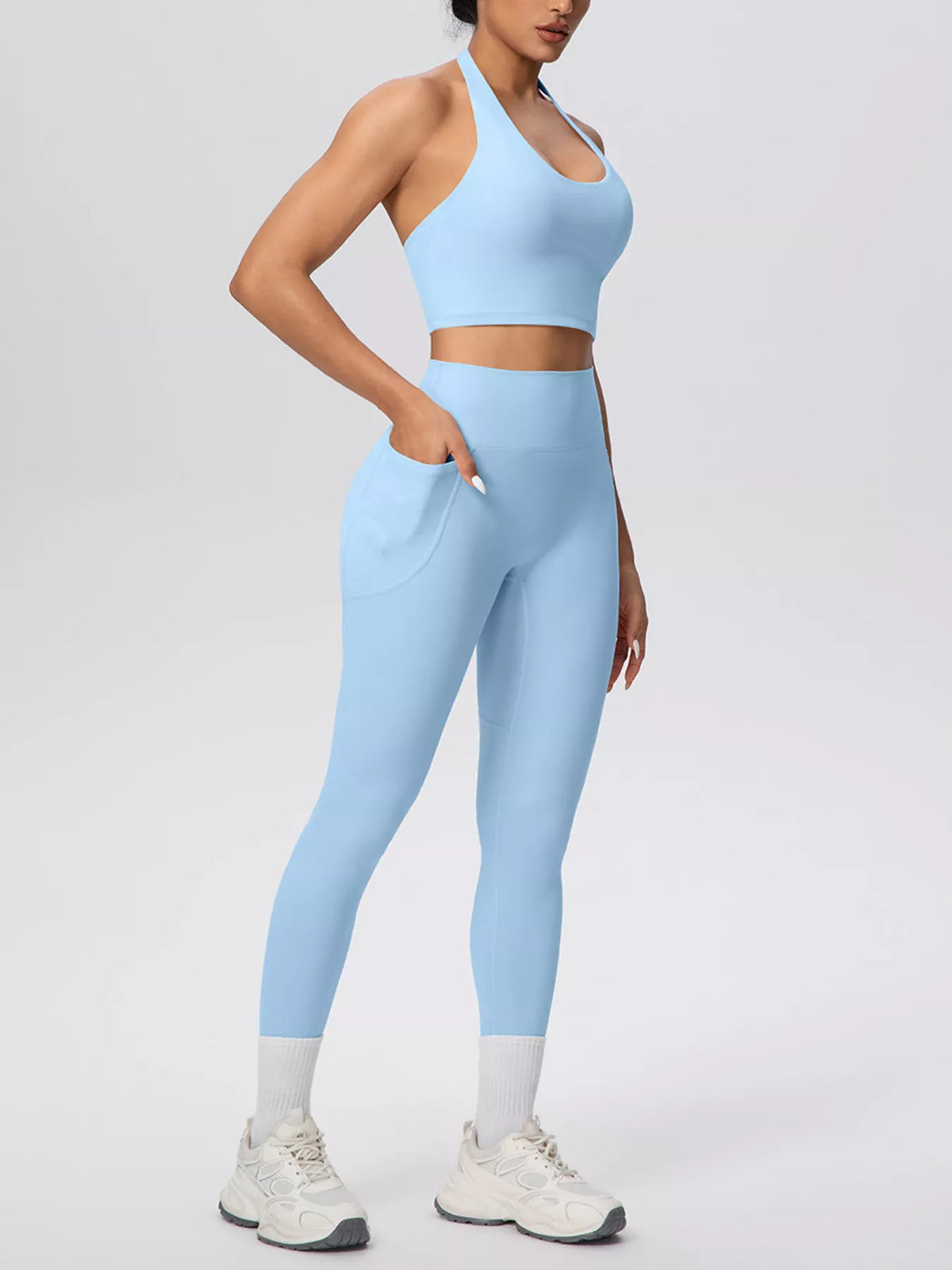 Back view of pale blue halter crop top and leggings