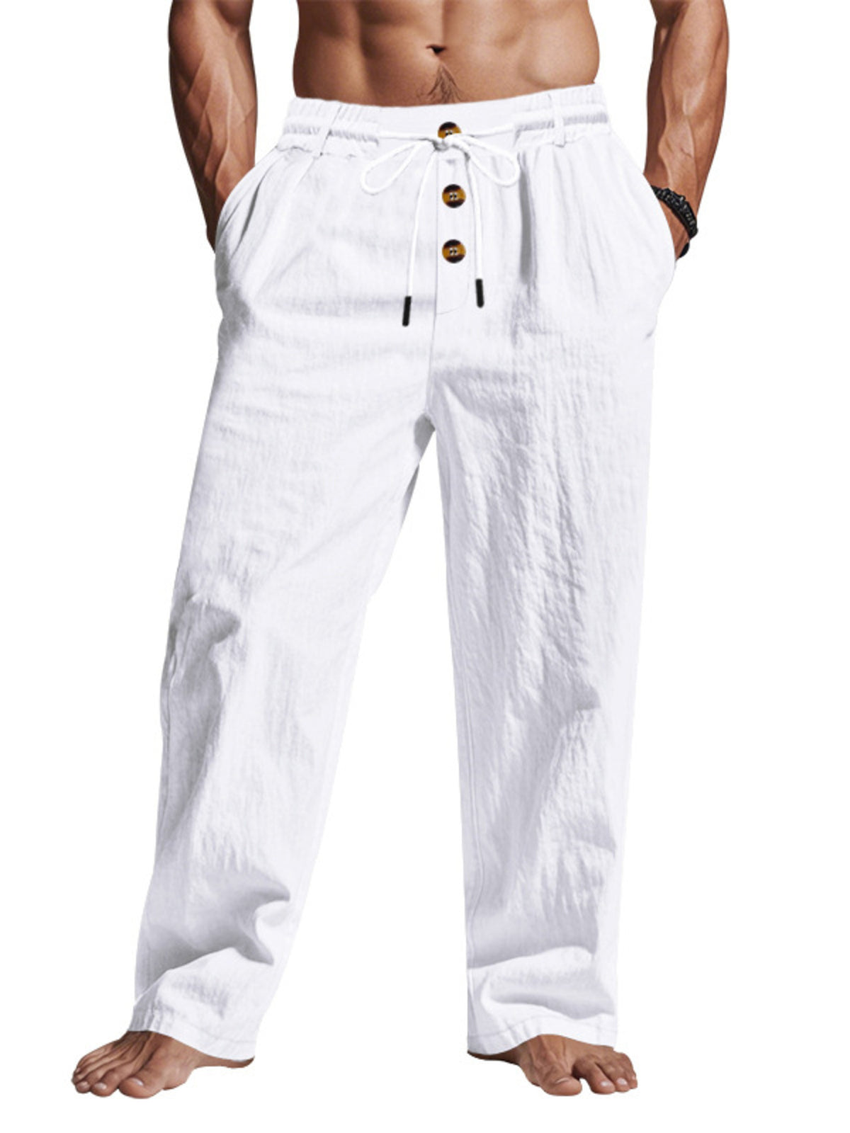 Front view of white drawstring pants with three buttons, worn with hands in pockets