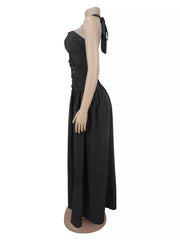 Side profile of black halter maxi dress on dress form