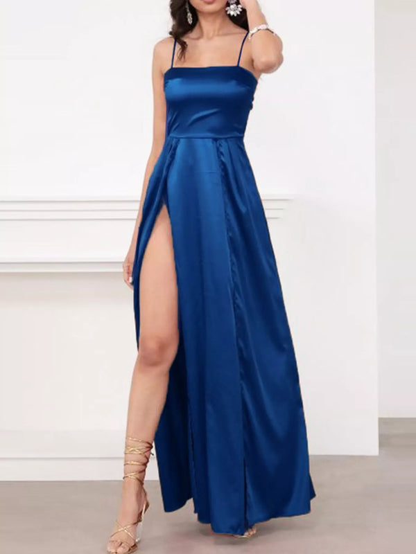 Model wearing a blue spaghetti-strap maxi dress with a high side slit