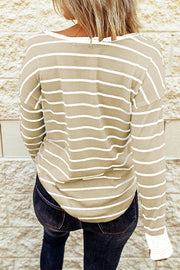 Back view of beige and white striped Henley