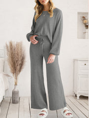 Full-length view of charcoal V-neck lounge top and matching wide-leg pants