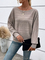 Women’s ribbed round-neck long-sleeve top in taupe front view holding dark clutch