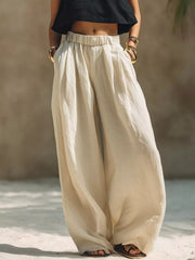 Cream plus-size wide-leg pants with elastic waist shown full length from the front