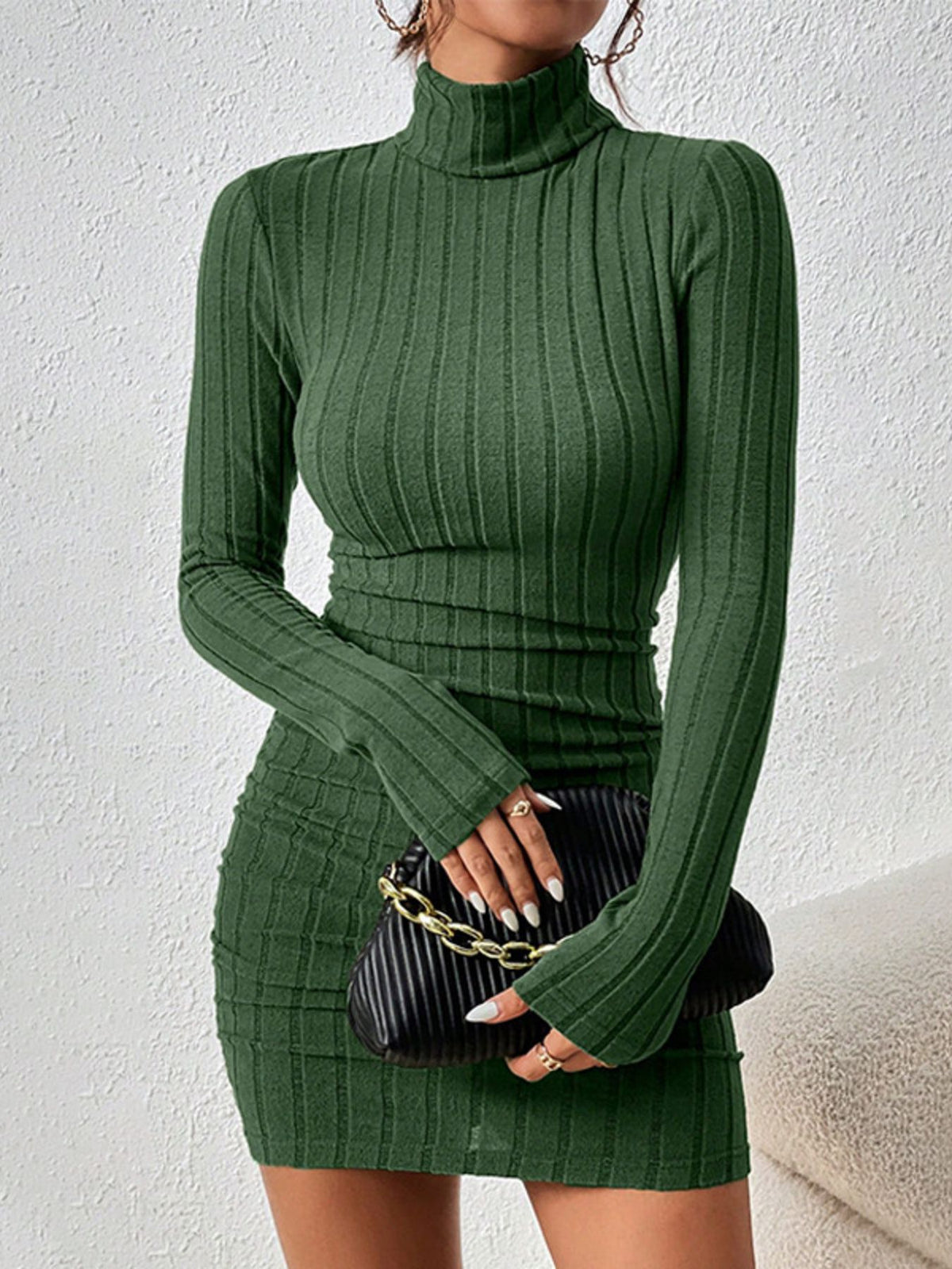 Front view of green ribbed turtleneck mini dress