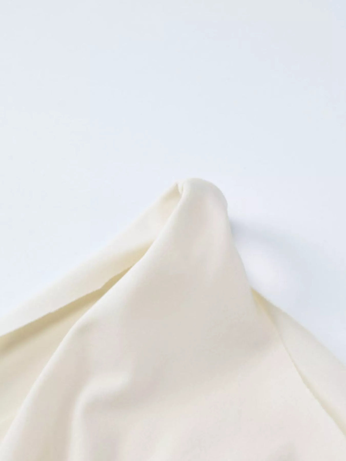 Close-up of ivory fabric drape detail