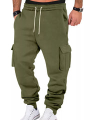 Model wearing olive cargo joggers, front view