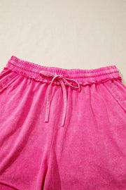 Close-up of elastic waistband and drawstring on pink shorts