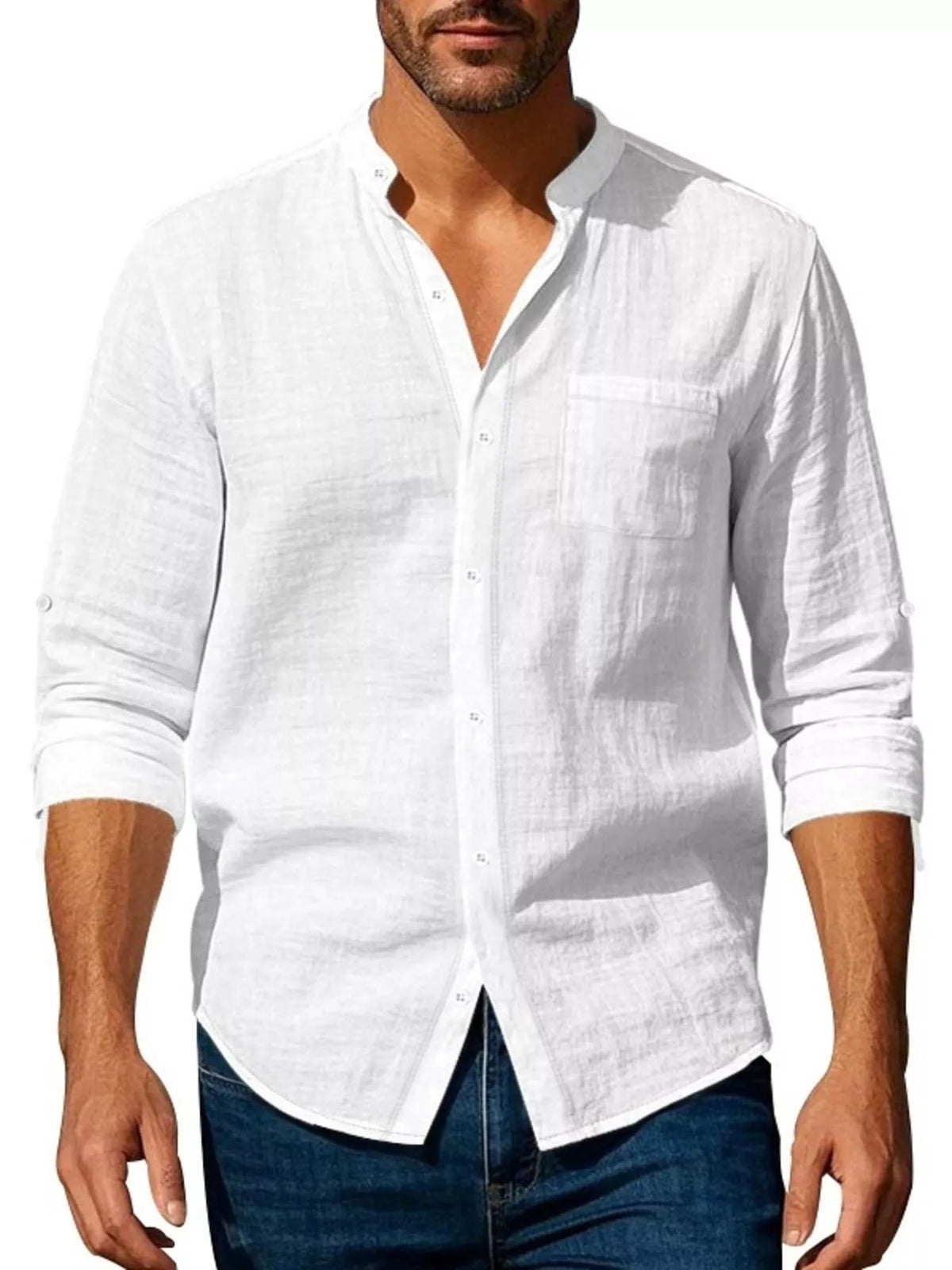 Men’s white button-up shirt styled with sleeves rolled and dark jeans