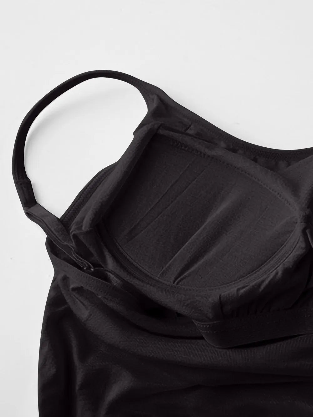 Close view of black cami dress straps and built-in bra cups