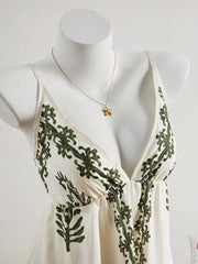 Close view of embroidered bodice and V neckline