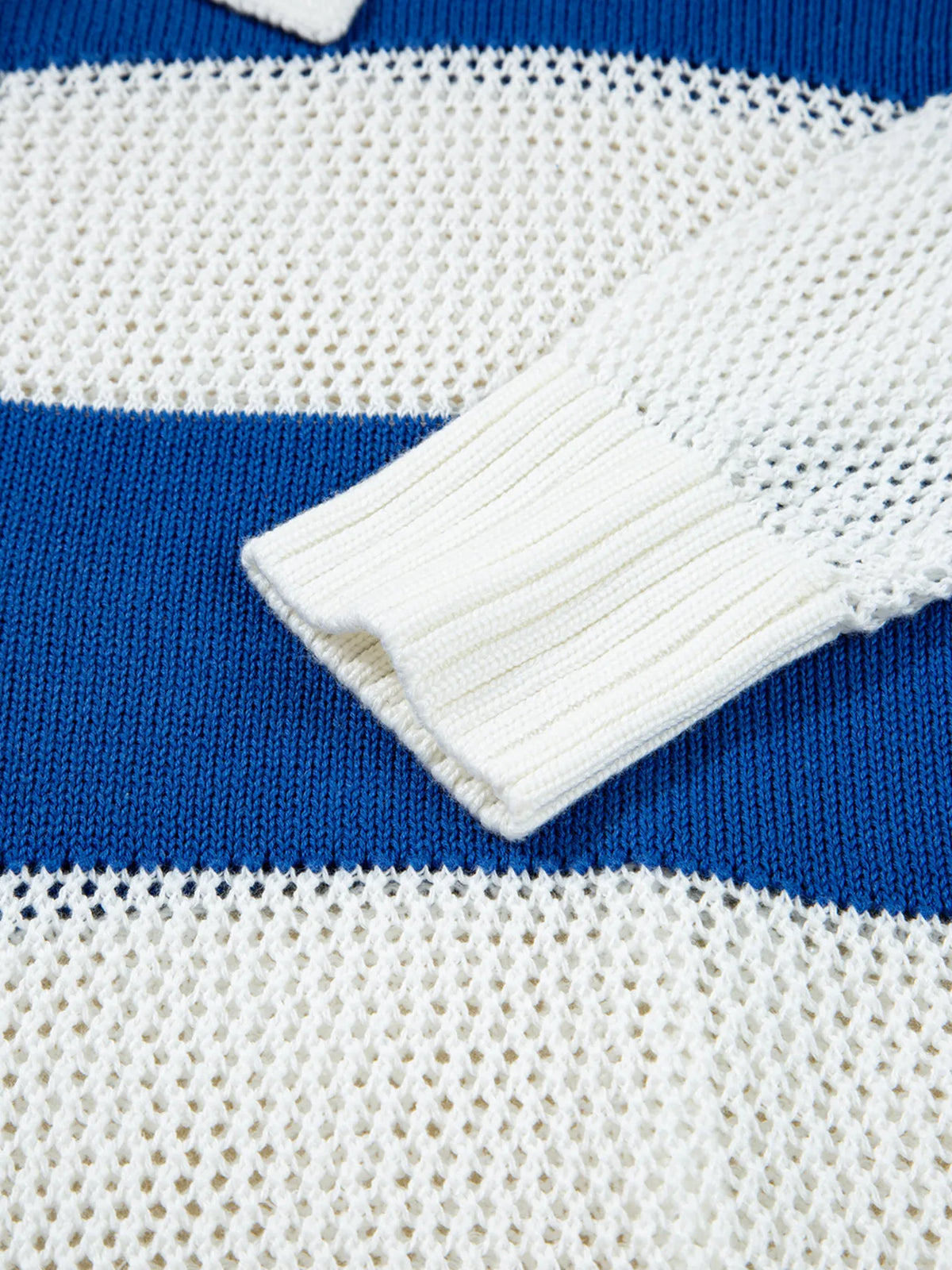 Close-up of long sleeve cuff and open-knit stripe