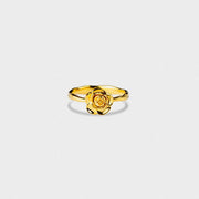 Gold-plated rose ring shown from above on a light background