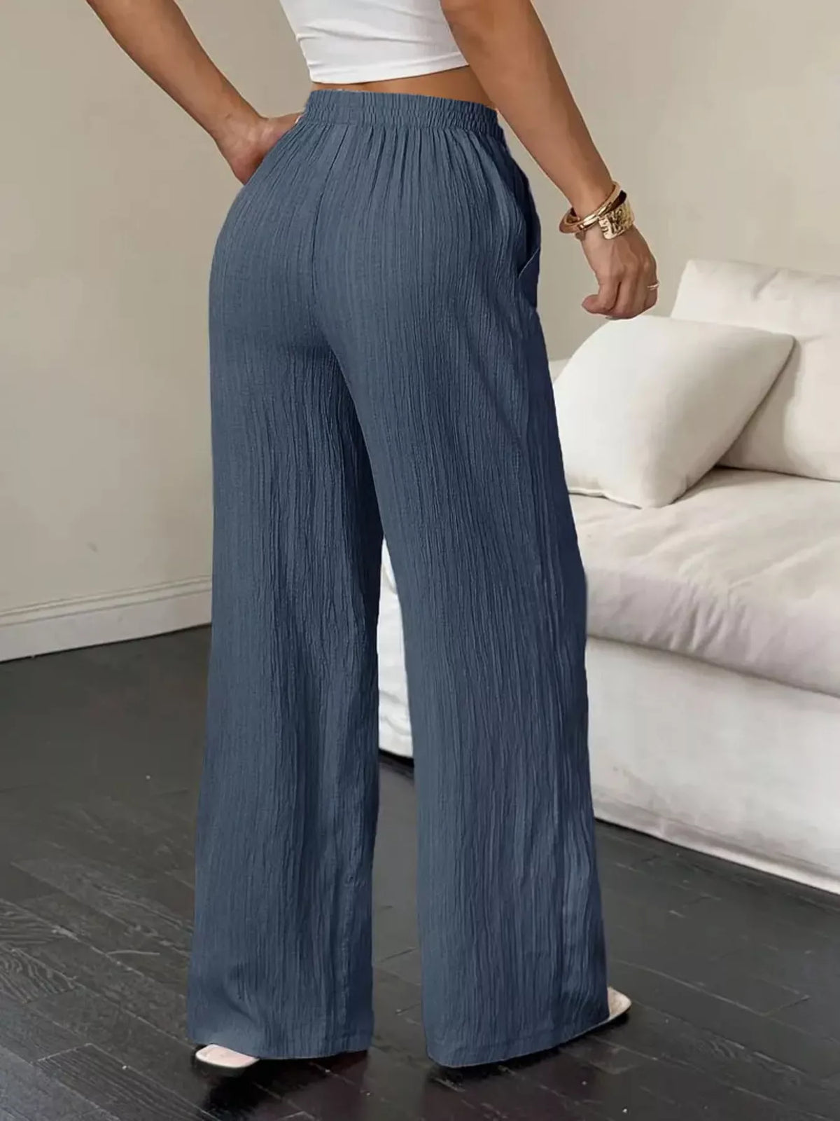 Front view of slate-blue wide-leg pants with drawstring waist and wide legs