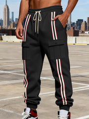Model wearing black cargo joggers in a city setting