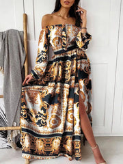 Full-length front view of the black and gold patterned off-shoulder maxi dress.