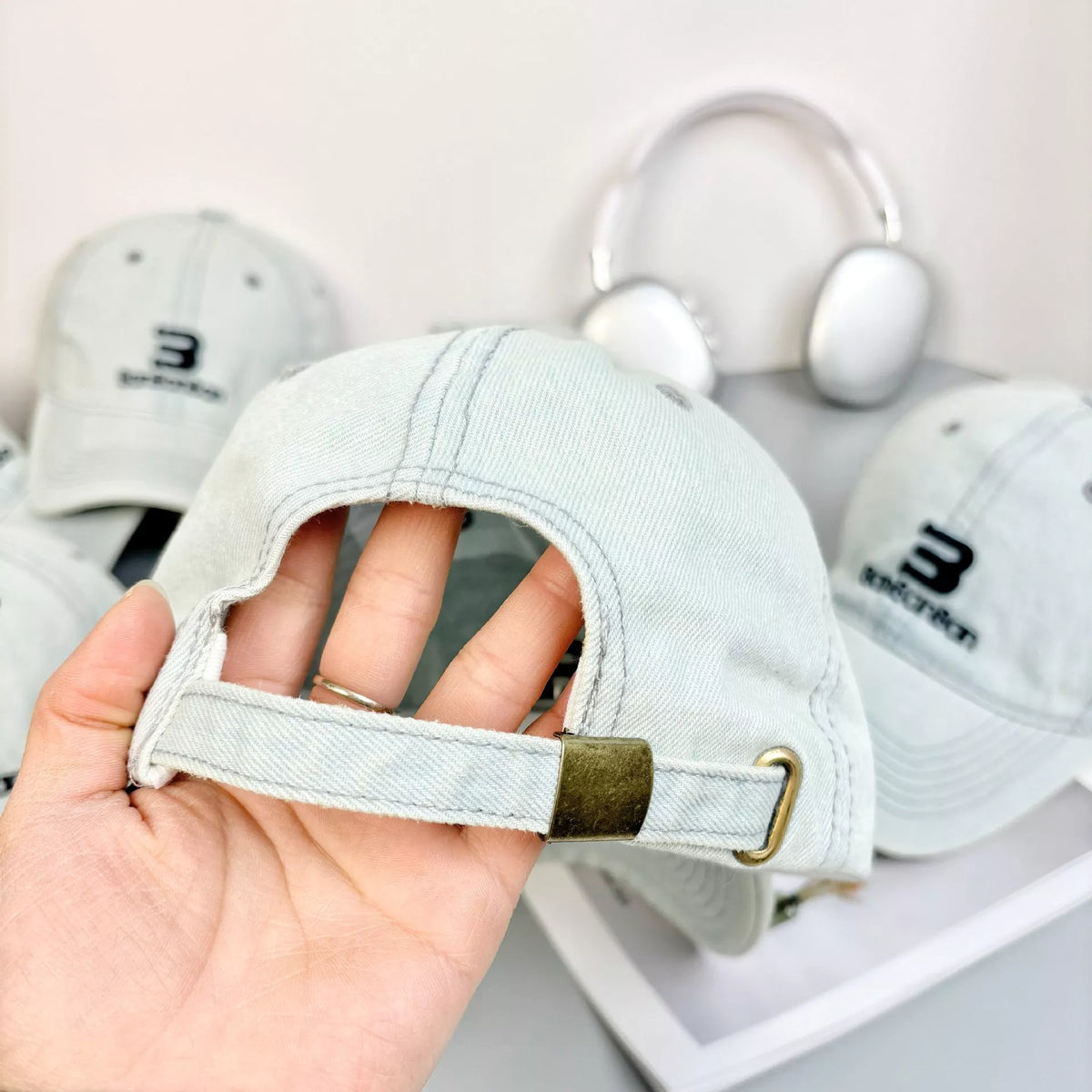 Light blue baseball cap showing embroidered front and denim panels