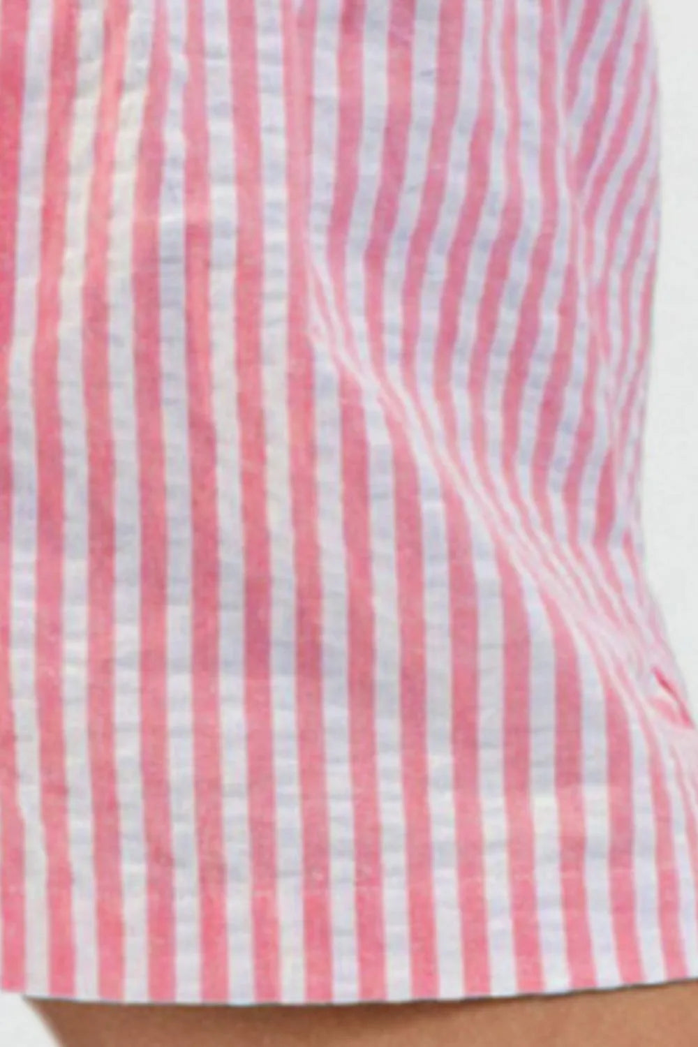 Rose pink striped shorts showing gathered waistband and button placket