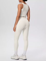 White tank and leggings in front view with side pockets