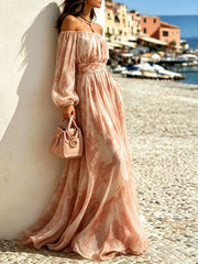 Side view of the peach off-shoulder dress showing the gathered waist and flowing hem