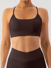 Front view of dark brown spaghetti-strap active bra