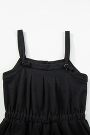 Back of black jumpsuit bodice with adjustable knotted shoulder straps