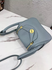Gray crossbody bag viewed from above with front flap visible