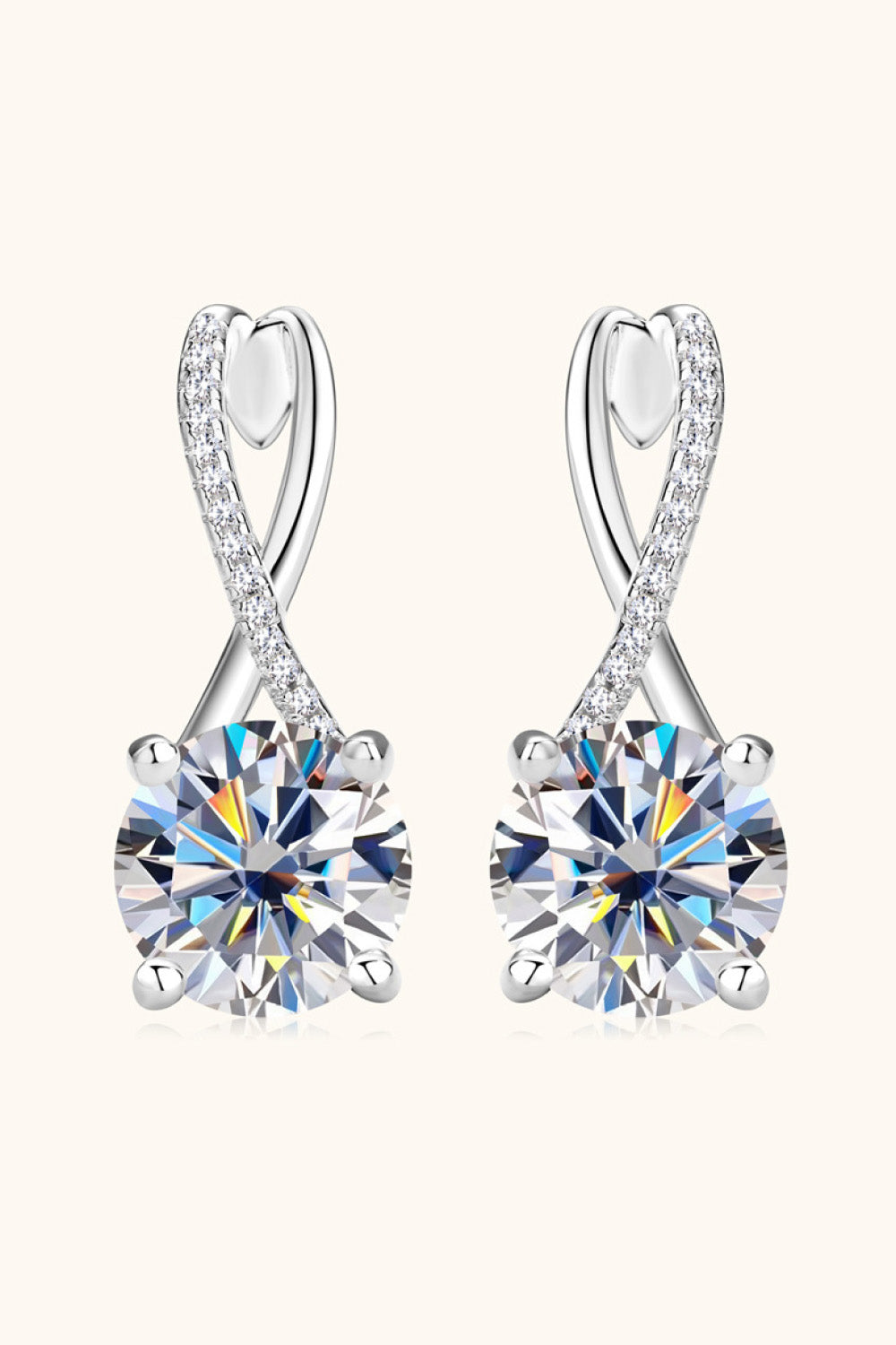 Front view of silver-tone drop earrings with crossed loops and round clear stones