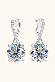 Front view of silver-tone drop earrings with crossed loops and round clear stones