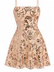 Close-up of the beige dress's straight neckline, waist seam and gold-toned floral sequins.