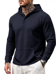 Model wearing navy hoodie showing front textured knit