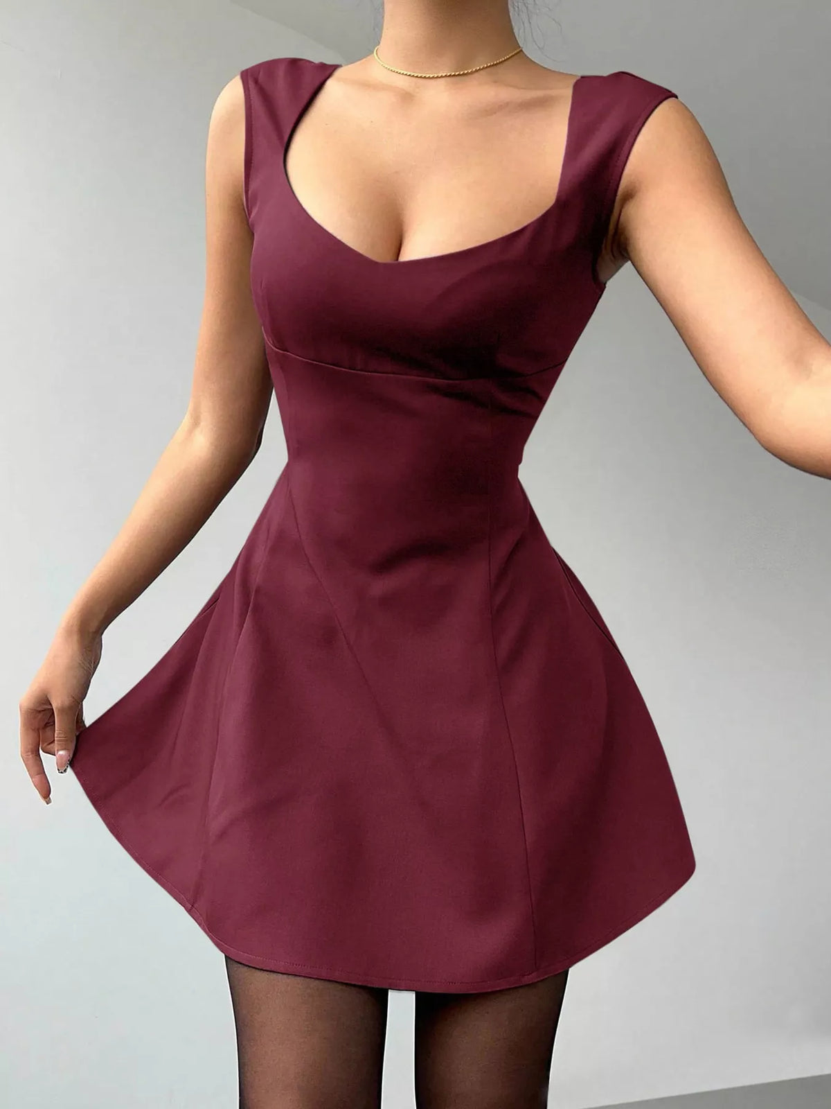 Front view of burgundy sleeveless A-line mini dress with scoop neckline