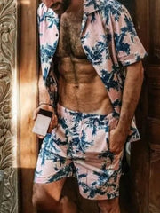 Model wearing pink palm-print short-sleeve shirt and matching shorts